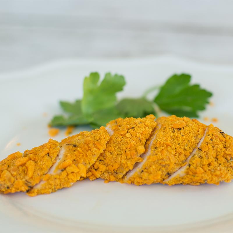 Crunchy Cheddar Chicken Tenders  on a plate cut into bite size portions